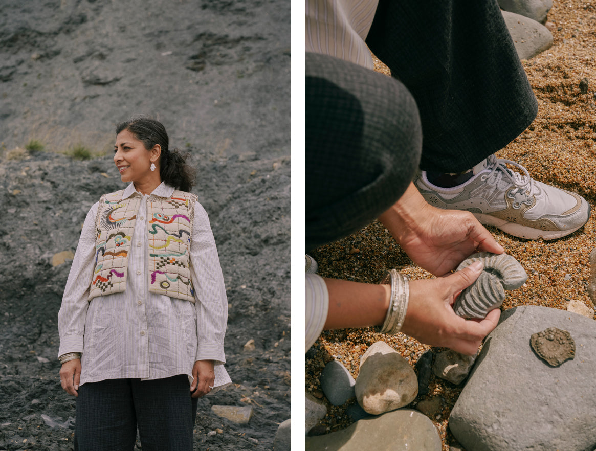 Earth scientist Anjana Khatwa wearing an embroidered vest and looking at fossils