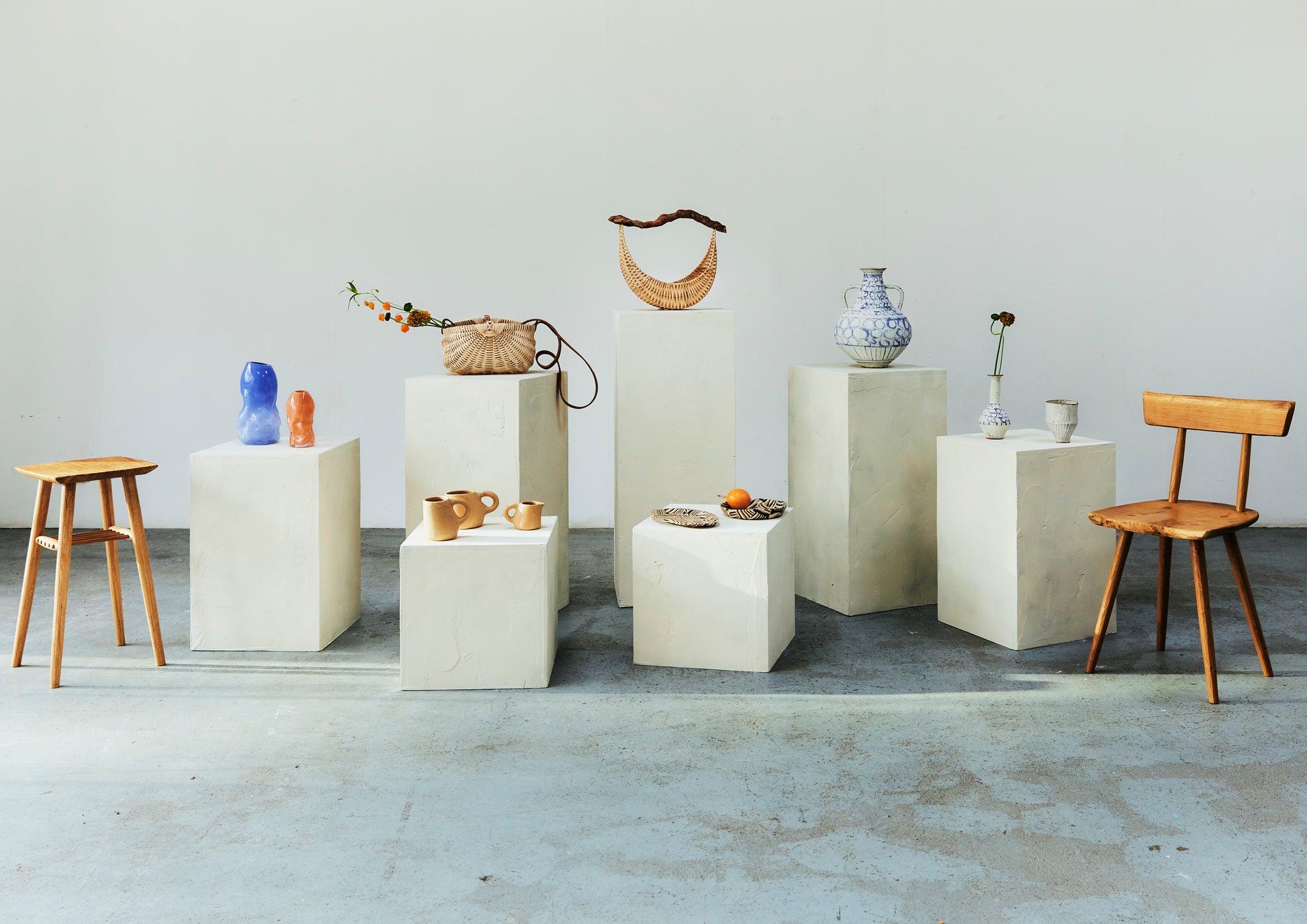 Craft objects on a white plinth