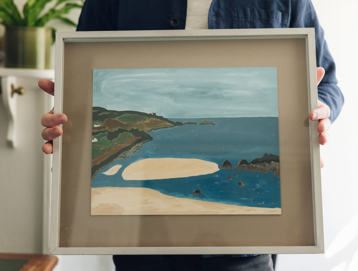 Tobias Vernon holding a seascape painting
